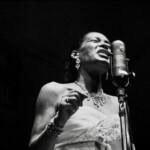 American jazz musician and singer-songwriter Eleanora Fagan, professionally known as Billie Holiday, performing on stage.