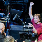 John Zorn, in red, conducts music from "Book of Angels" with the Bar Kokhba Sextet (featuring Marc Ribot on guitar, Mark Feldman on violin, Erik Friedlander on cello and Cyro Baptista on percussion) during his "Masada Marathon" at Lincoln Center in New York on March 30, 2011.