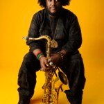 Kamasi Washington poses for photos with his saxophone "The Duchess" at The Atom Factory in Culver City, CA (March 8, 2016)