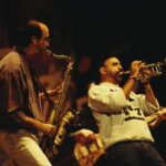 Saxophonist Michael Brecker (1949-2007) on left and trumpet player Randy Brecker of The Brecker Brothers perform live on stage together in the United States circa 1995. (Photo by Michael Putland/Getty Images)