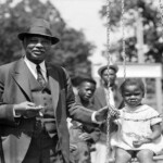 NEGRO BLUES COMPOSER, PLAYING CHCILDREN, SWING POSING