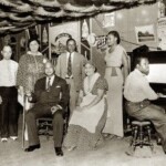 W.C. Handy visiting Old Rock House Saloon. Handy seated with cane, with entertainers and guests. Photograph by unknown,  ca. 1935 Missouri History Museum Archives. Restaurants and Bars  n21255