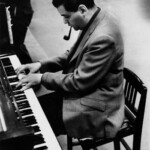 1961 --- Jazz composer George Russell at the piano during the recording of his Ezz-thetics album at the Riverside records studio. --- Image by © Steve Schapiro/Corbis